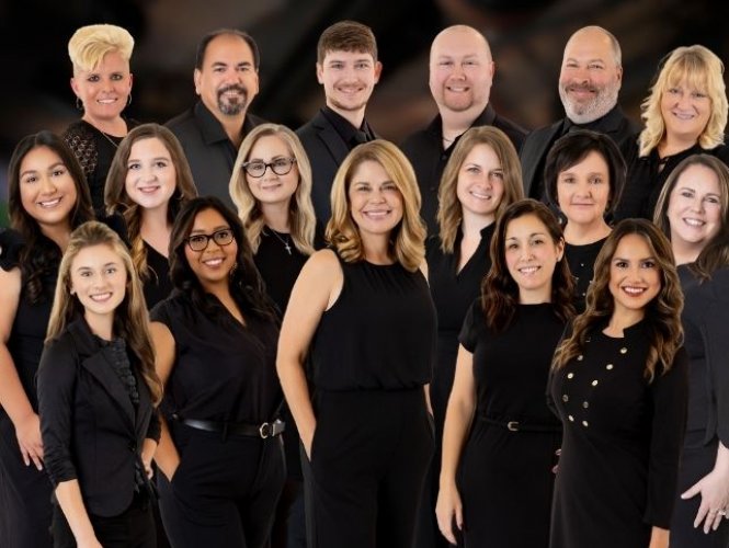 Beth's team with logo in front