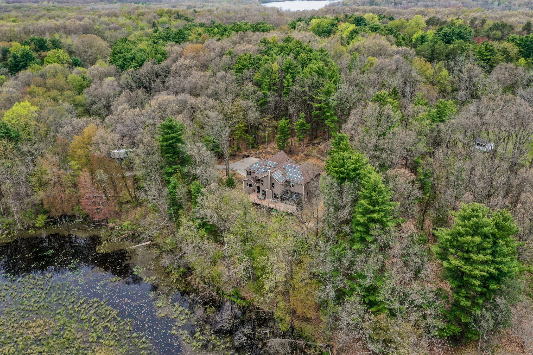 13725 S Rainbow Dr, Gregory, MI 48137. Enjoy privacy and water views on 5+ acres!