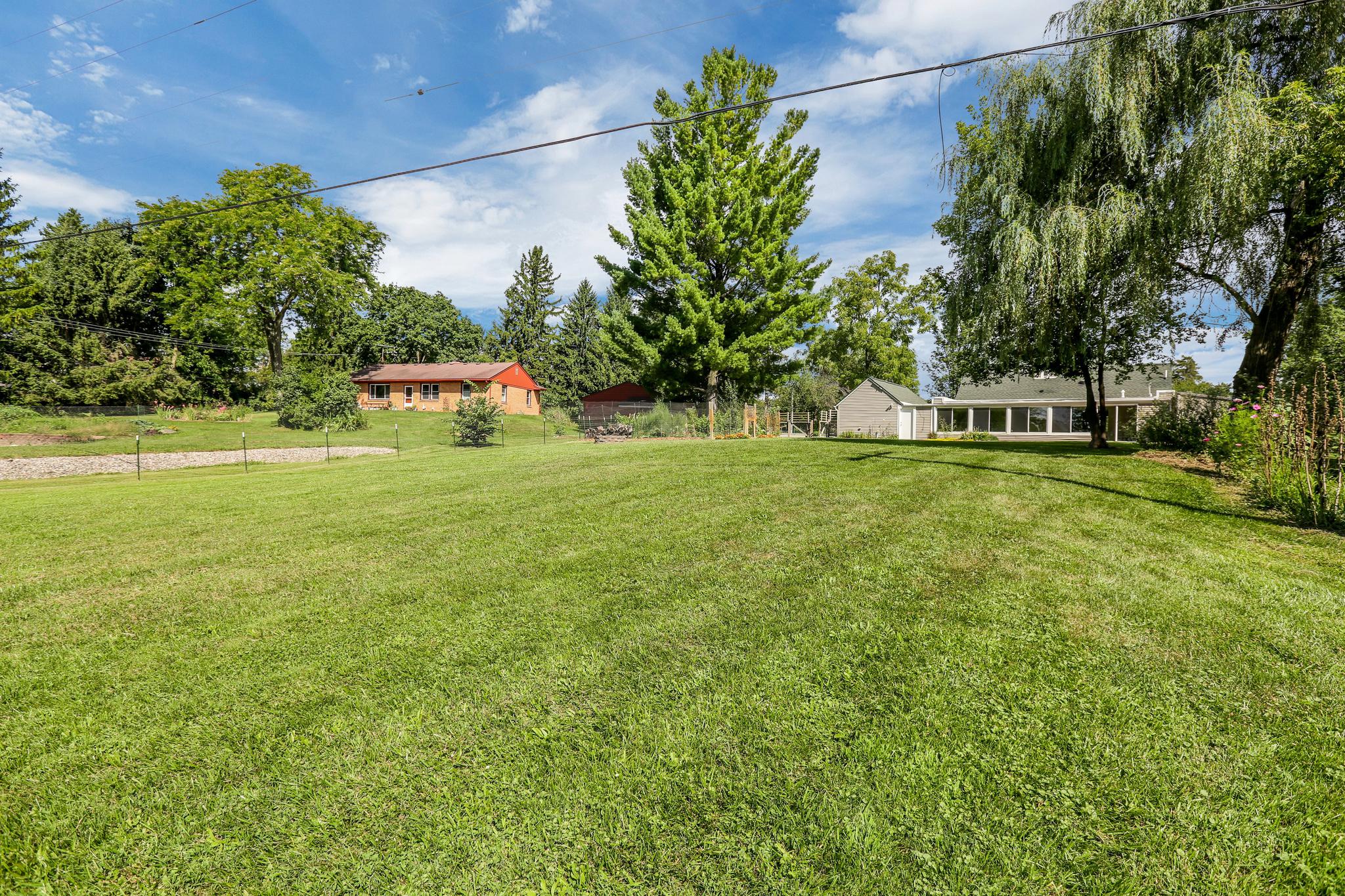 1684 Warren Rd, Ann Arbor, MI 48105. Lightfilled and private home in