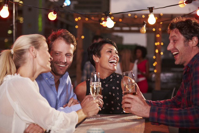 enjoying a drink at a bar in sutton place