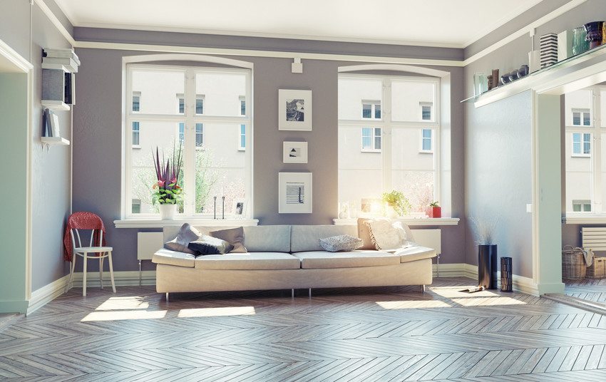 A gray couch in a living room in a condo.
