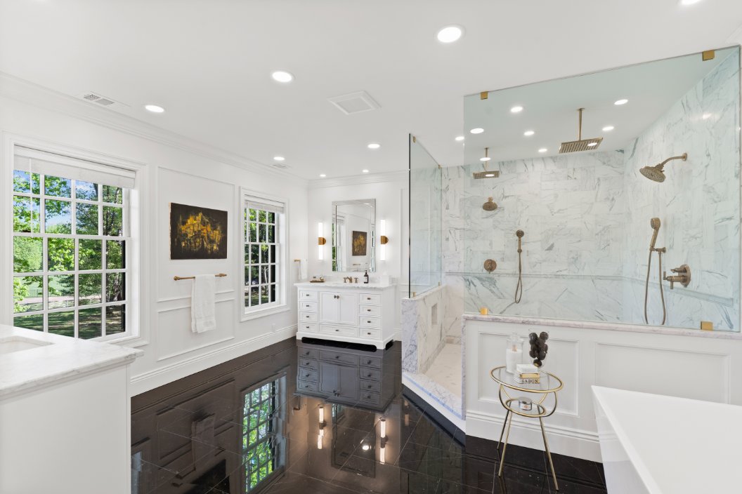 bathroom with black wide-plank hardwood floors