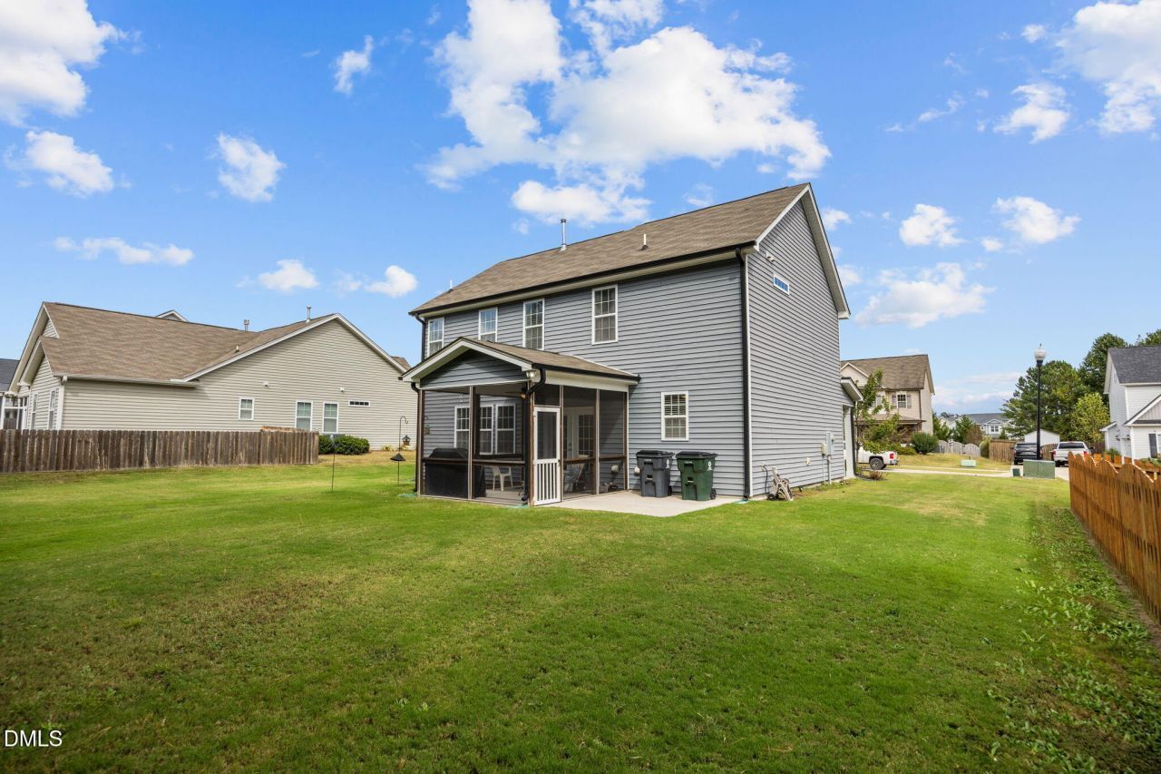 Rear View of a Spacious Weavers Pond Home With Screened in Porch