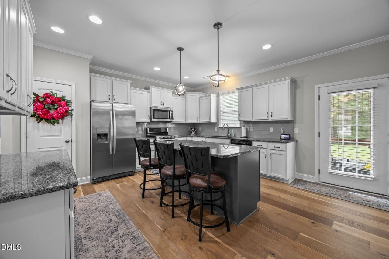 Open Kitchen With Island in a Weavers Pond Home