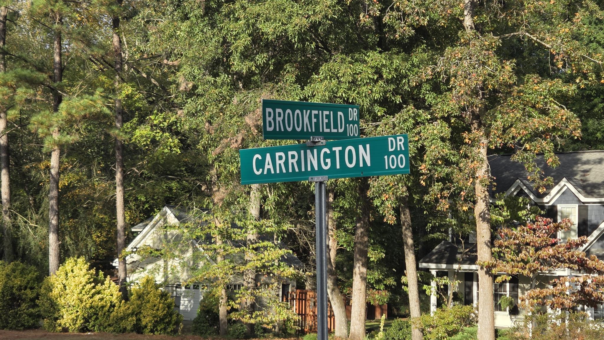 Street signs for Carrington Woods and Brookfield Station in Knightdale NC