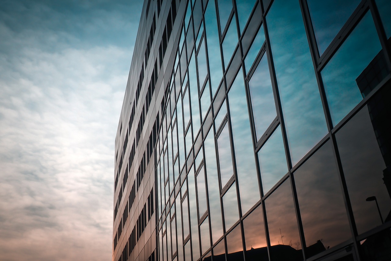 Exterior of an office building reflecting the sunrise.