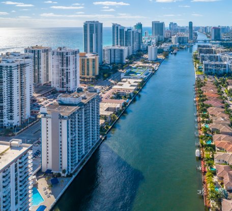 aerial of city with beach