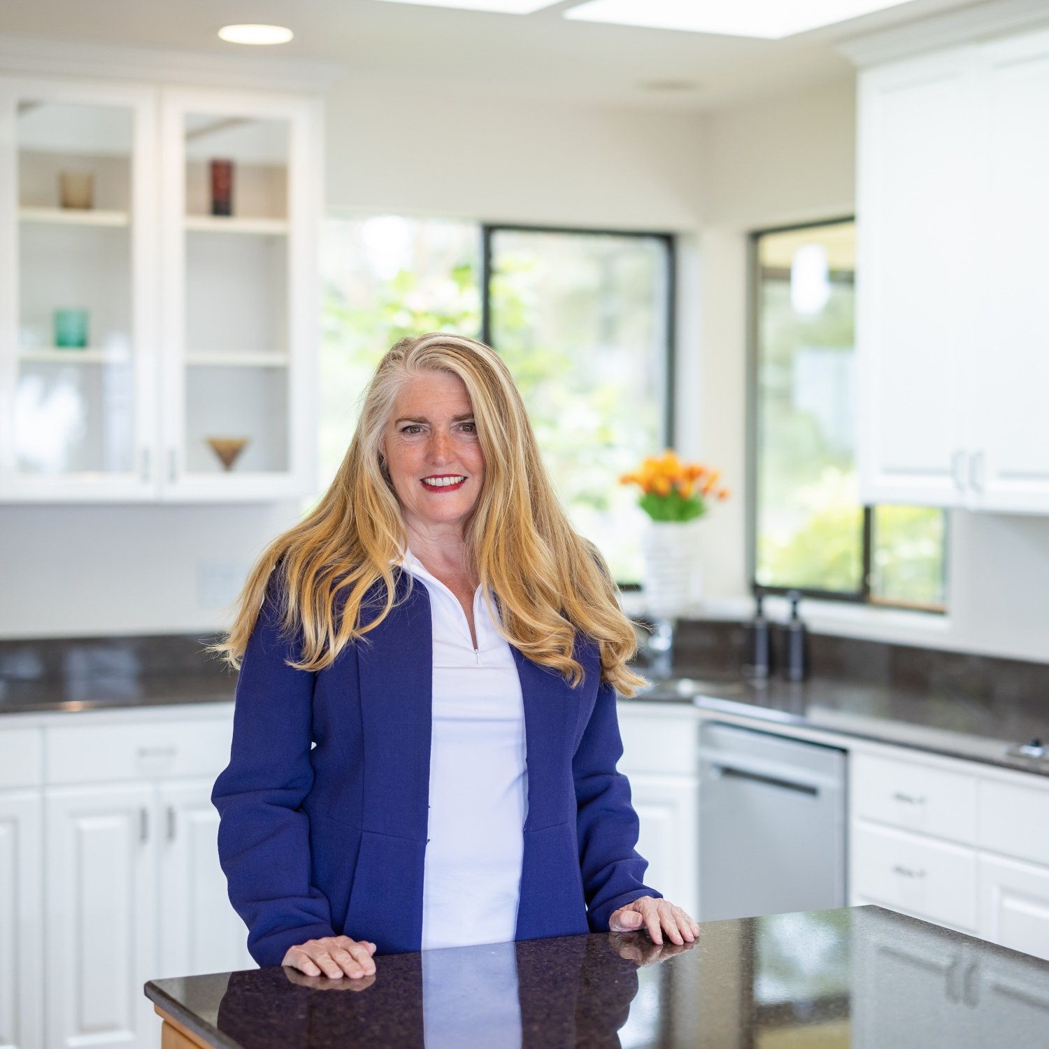 Eileen with a white kitchen in background