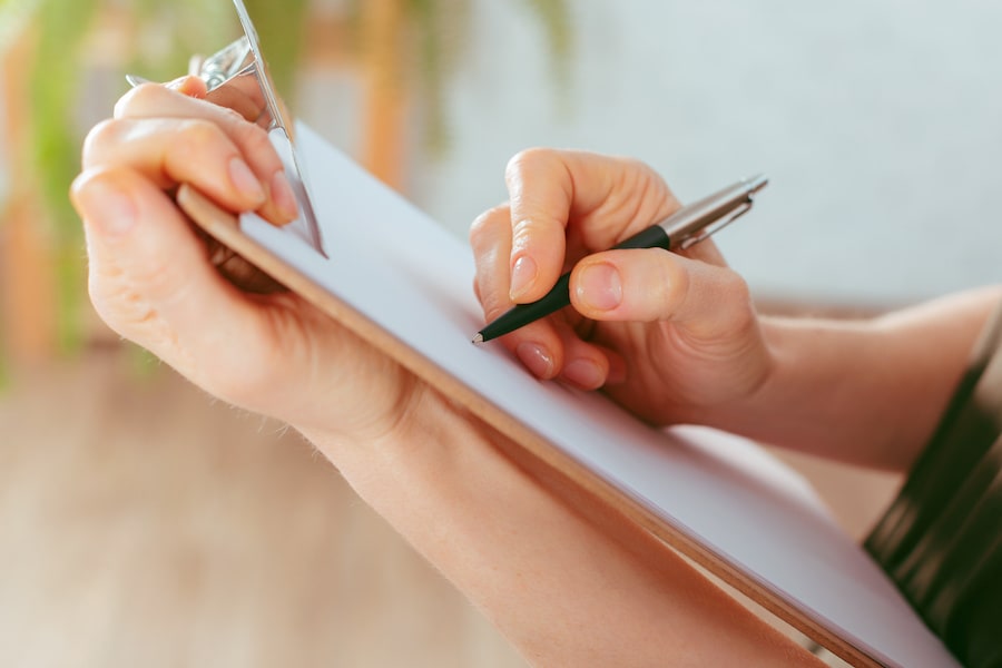 woman holding clipboard