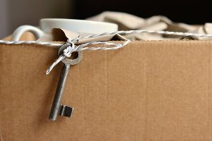 box full of kitchen cups and utensils