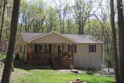 Many homes are nestled on wooded lots