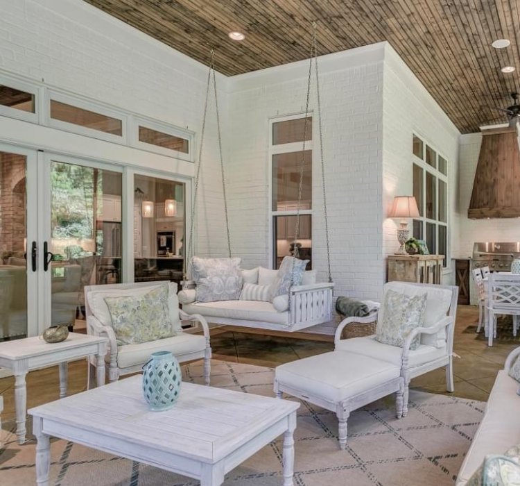 Outdoor seating area with hanging swing