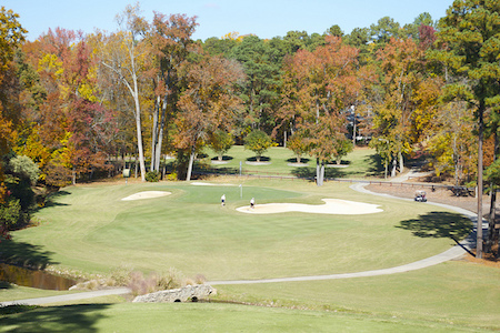 Golfers avoiding sand traps in a golf course in Cary, NC.