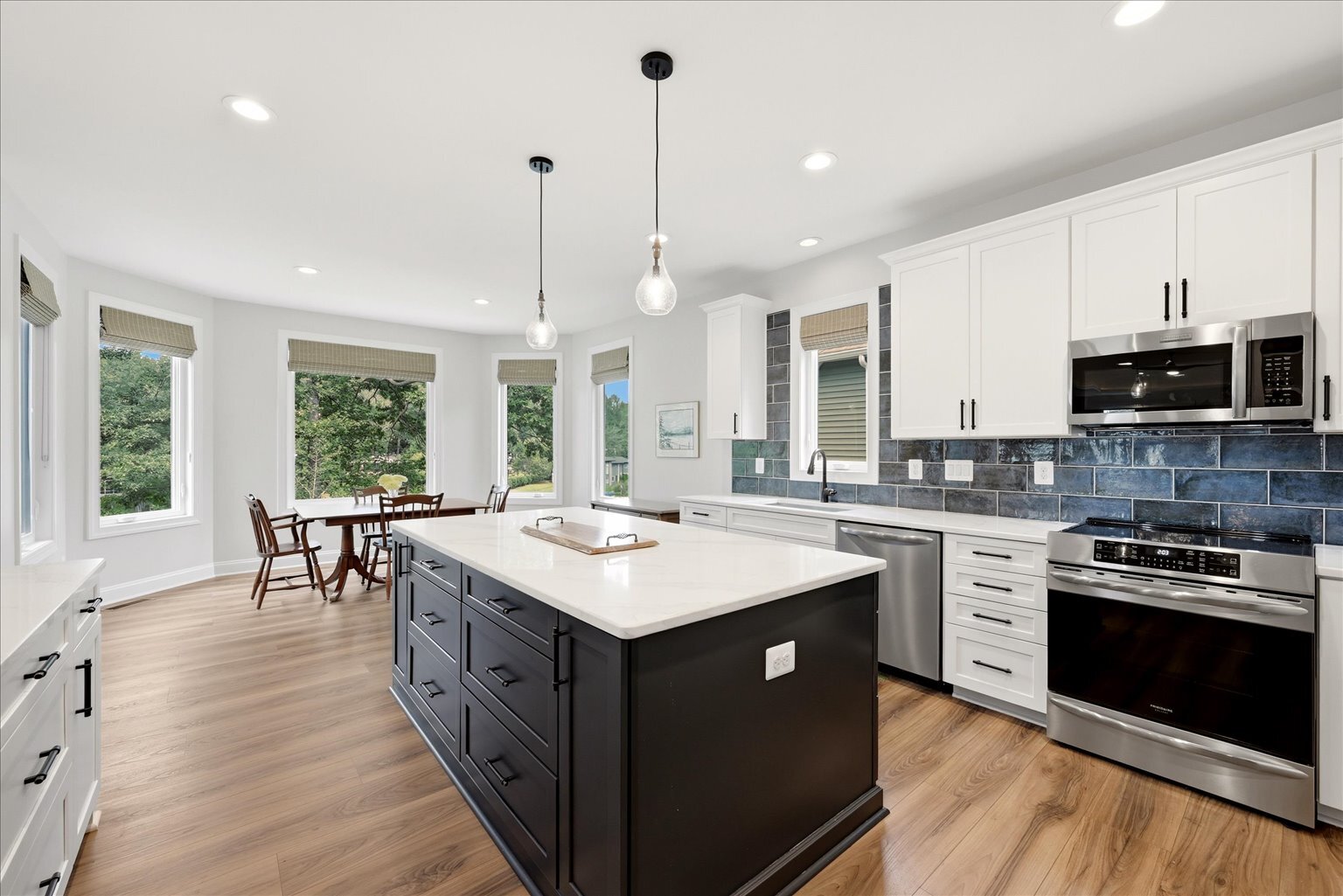 Kitchen Leading to Sunlit Breakfast Area