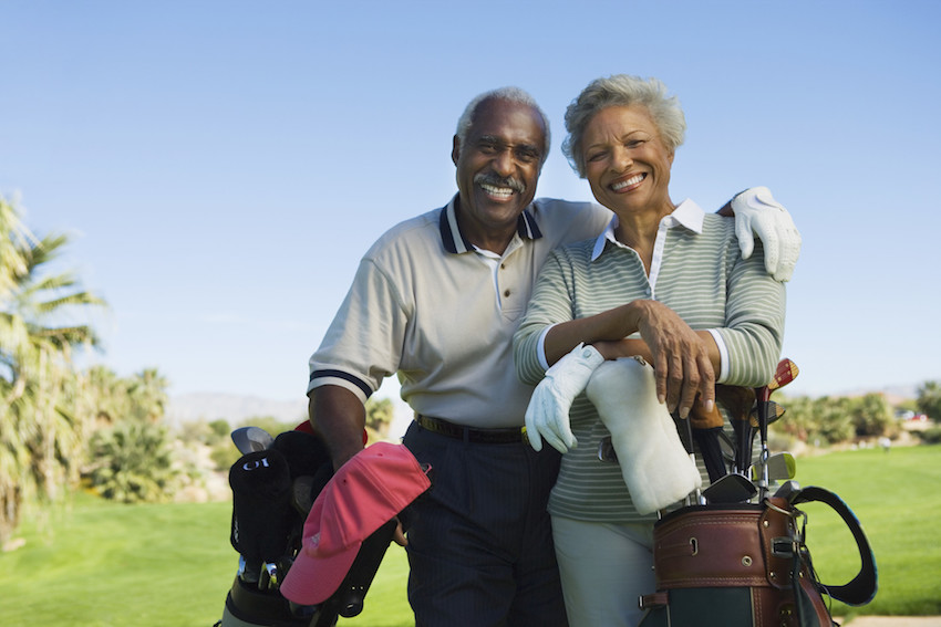 active couple golfing