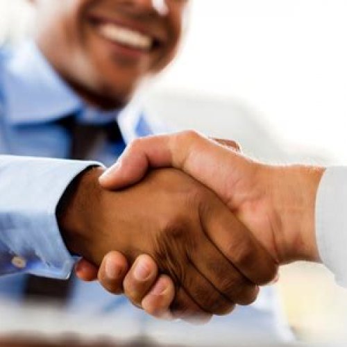 Hands all in Sitting at A Wooden Table