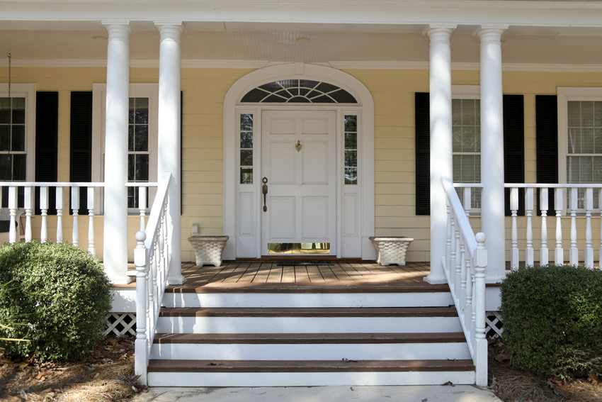 the front porch and front door of a beautiful home