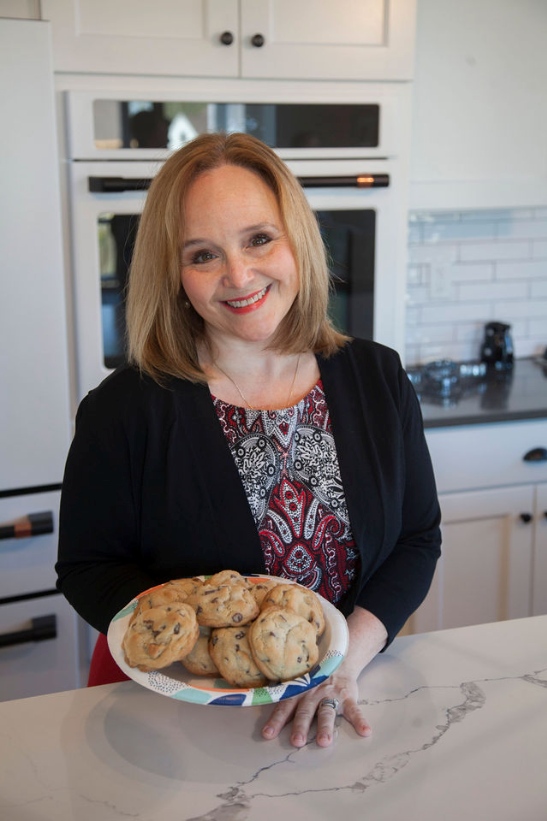 Julie Picknell holding a plate of baked cookies