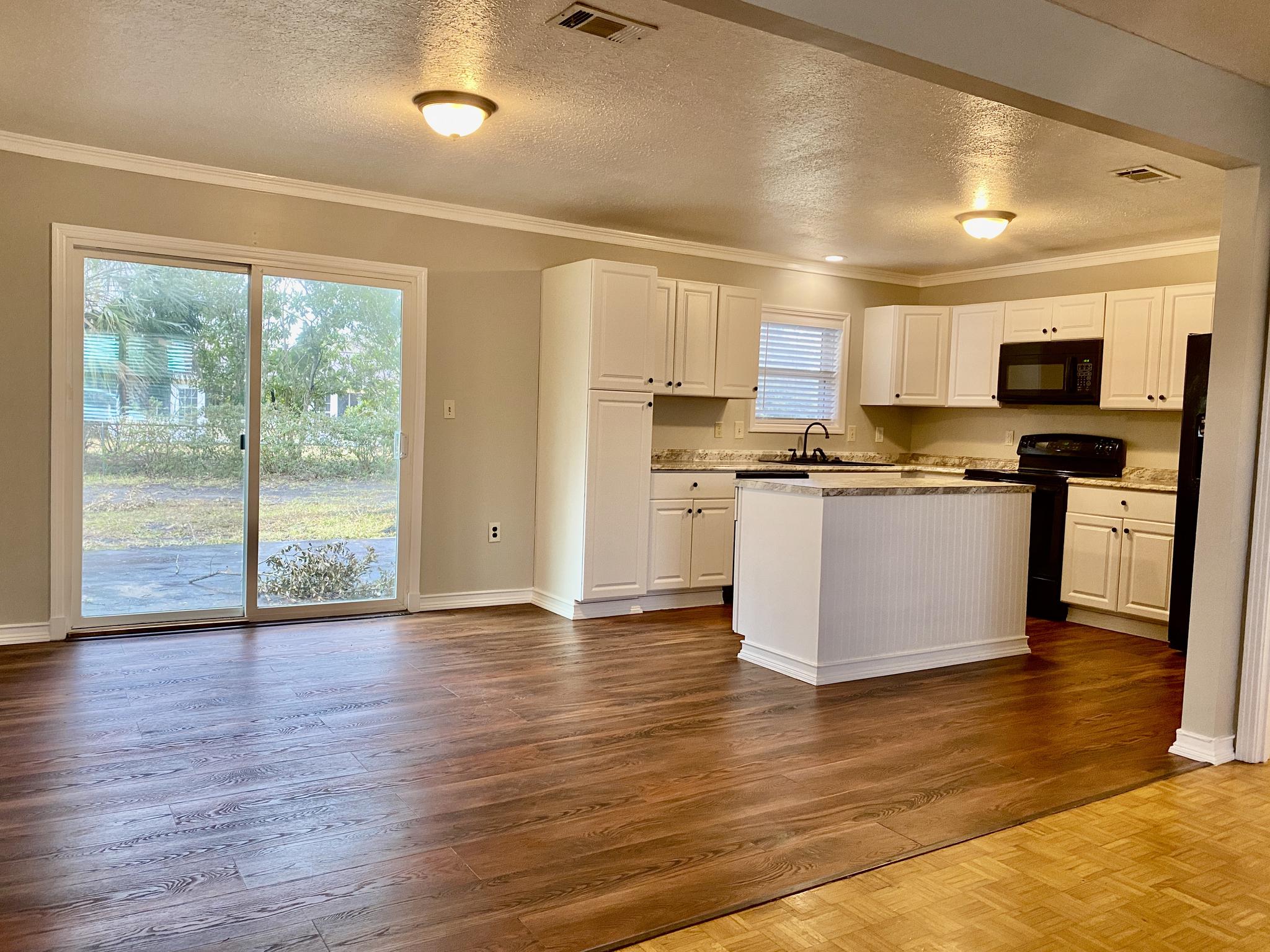 Eat-in kitchen with sliding glass doors to the back patio