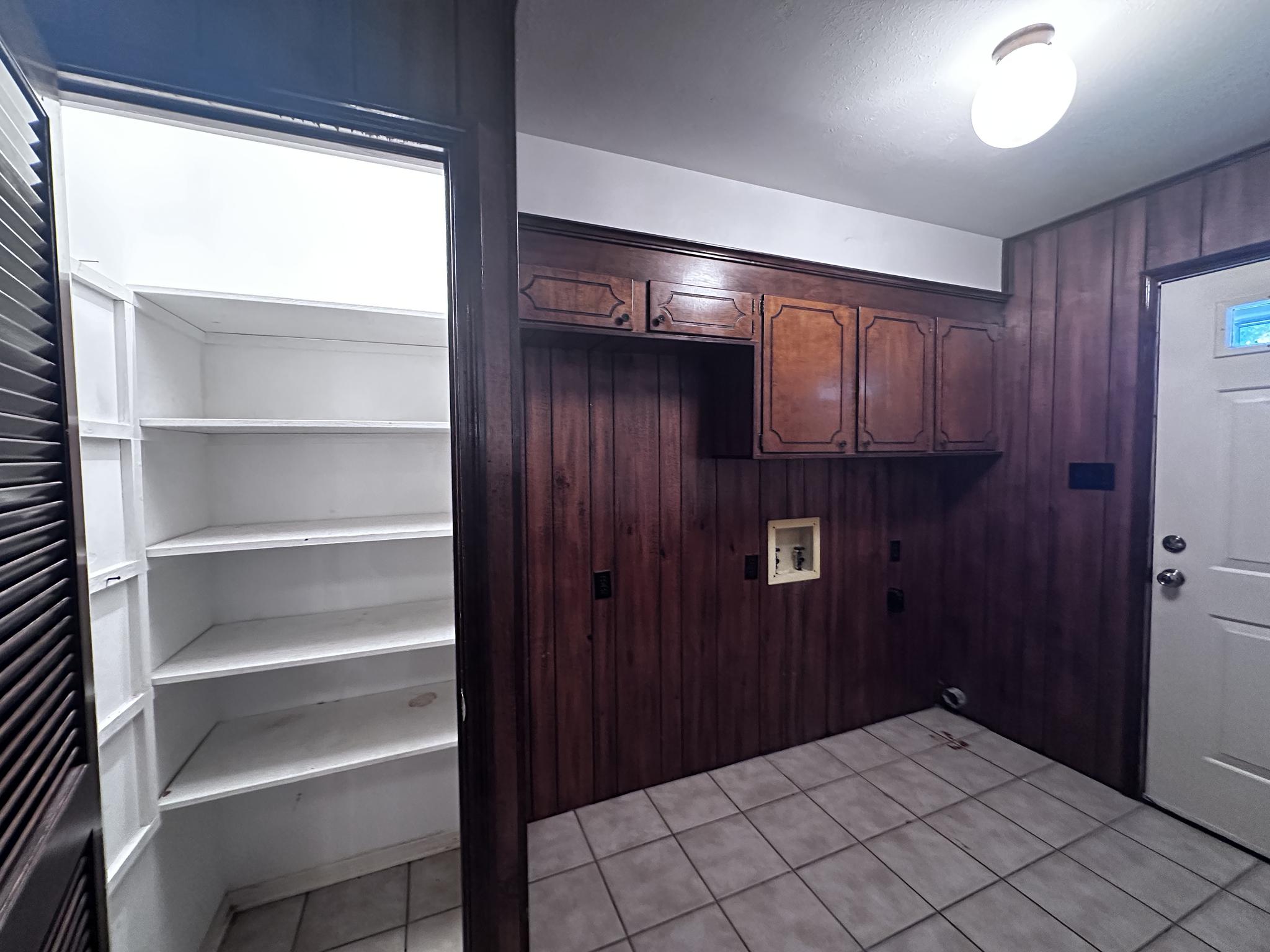 Laundry room with pantry