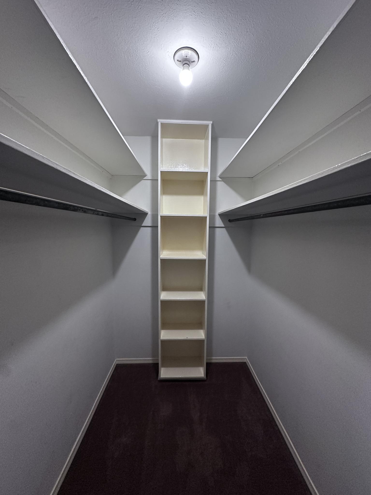 Walk-in closet in primary bedroom