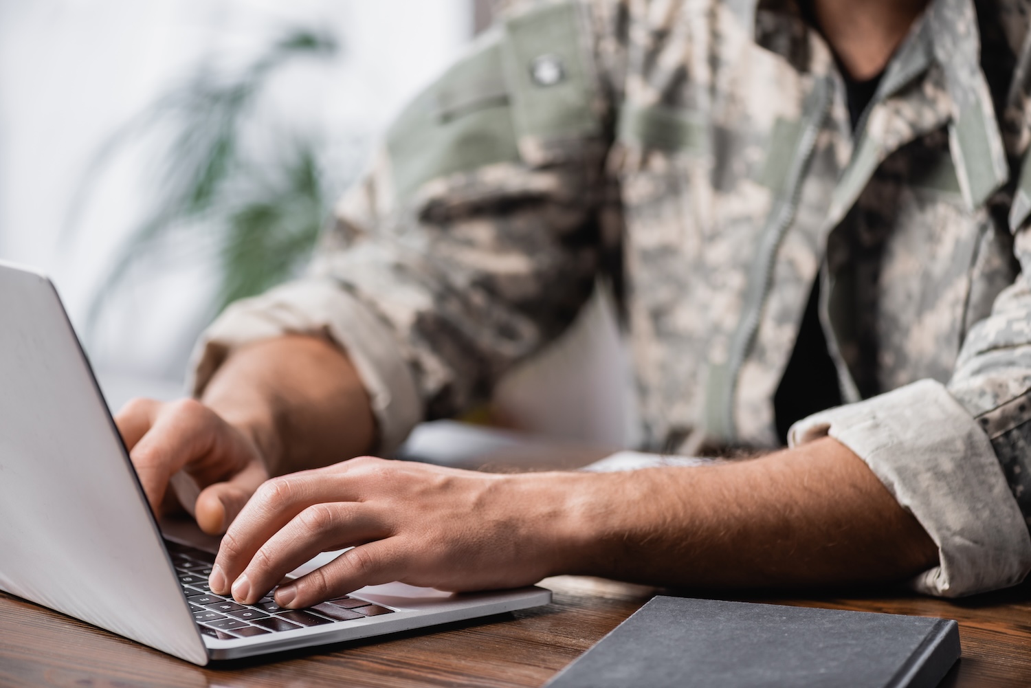 military member on laptop