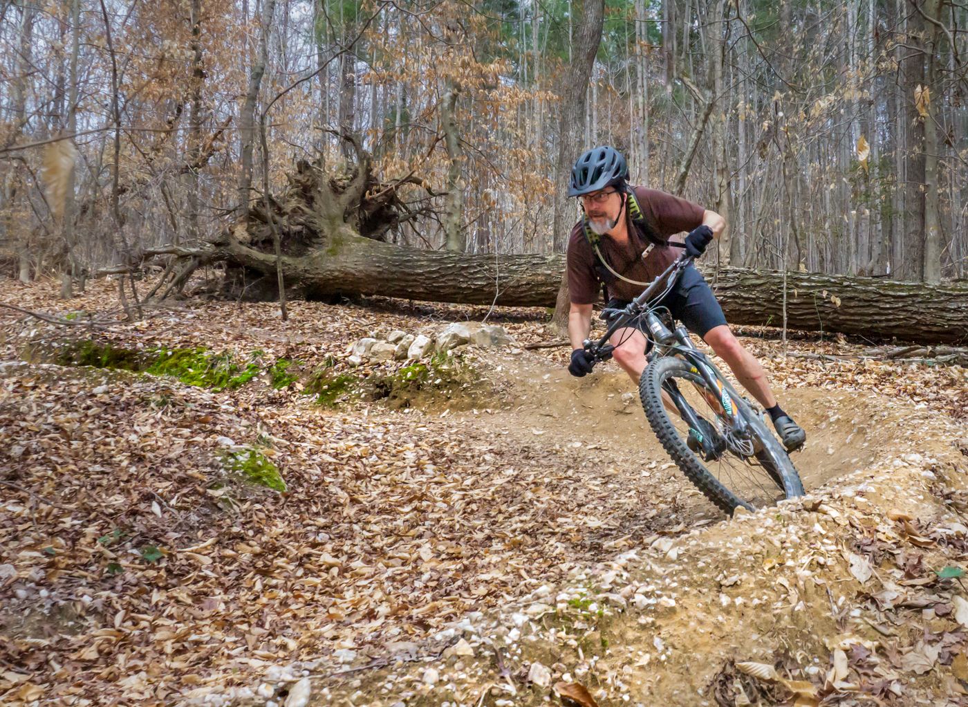 Mountain biker on a wooded trail at San-Lee Park in Sanford NC