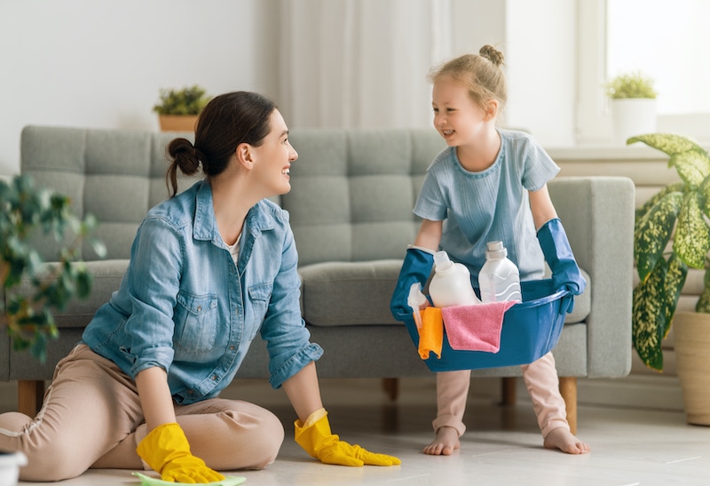 A mother and daughter cleaning